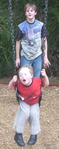 Jacob  playing with his brother Jonathan - a kid with Down Syndrome is just as much part of a family as any kid is