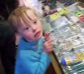 Jacob, a child with Down Syndrome,  enjoying a family holiday and browsing in shops, like any other 5 year old child would.