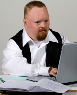 Adult man with Downs syndrome working or studying