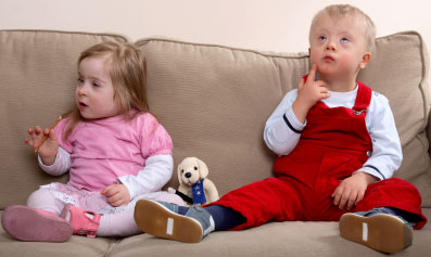 Boy and girl children with Down syndrome