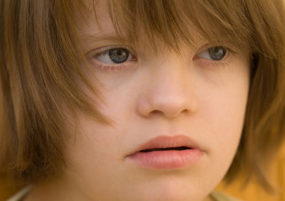 Close up of girls face with Down syndrome