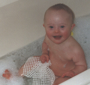 Jacob with Down Syndrome aged 15 months in the bath.