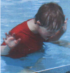 Jacob, aged 6 years, learning to swim - a kid with Down Syndrome can learn to do just about anything with good caring instructors.