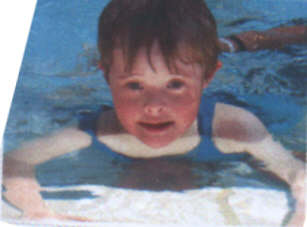 Jacob, a kid with Down Syndrome, aged 6 years, learning to swim - this picture included because he looks so good.