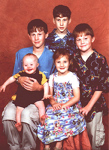 Jacob, with Down Syndrome, aged 1 year, with his brothers and sister.